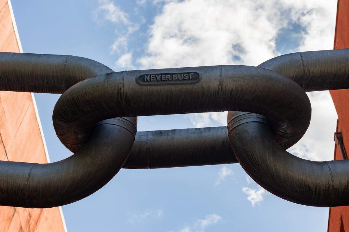 Blue Sky’s “Never Bust” sculpture hangs between Main Street’s Kress and Sylvan buildings across from the Columbia Museum of Art on Tuesday, April 1, 2025.