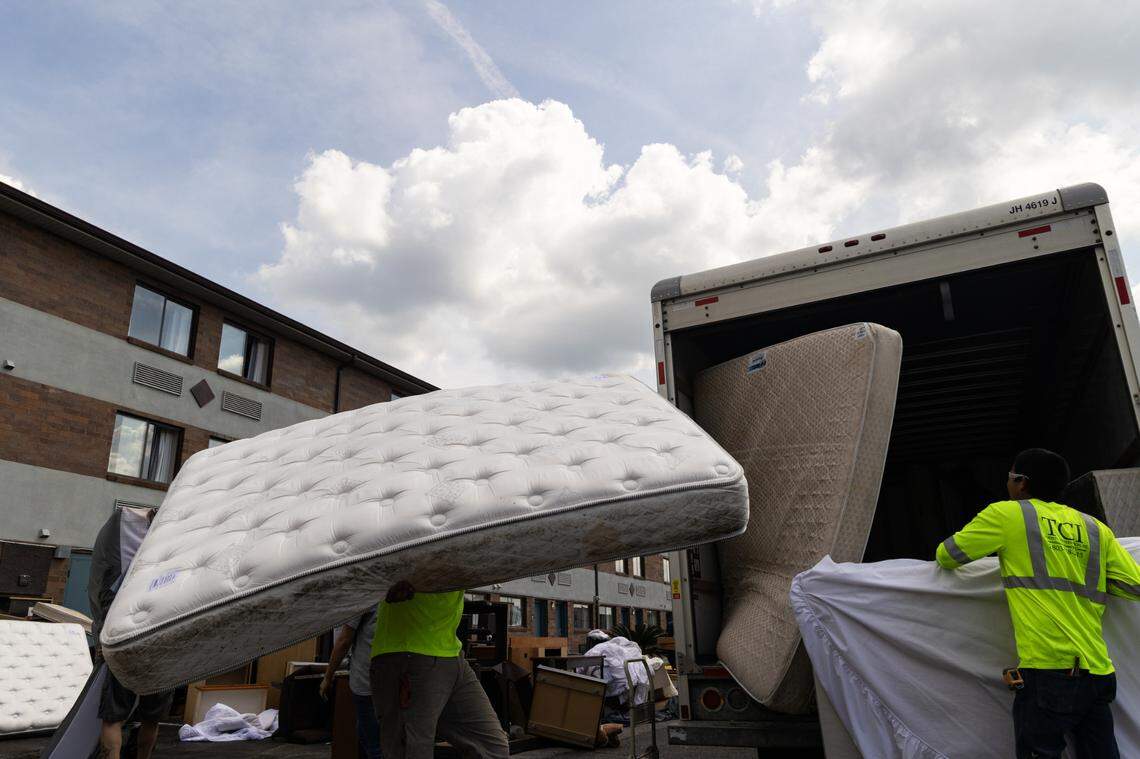 Workers take out old furniture from the Suburban Studios on Bush River Road on Wednesday, April 30, 2025. Homeless No More, a local nonprofit, are working with Lexington County to make 31 housing units for people transitioning out of homelessness.