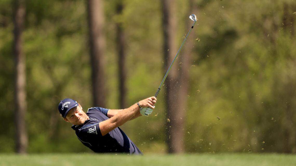 Masters champion Danny Willett of England plays a stroke from the No. 12 tee during the first round of the Masters at Augusta National Golf Club, Thursday, April 7, 2022.