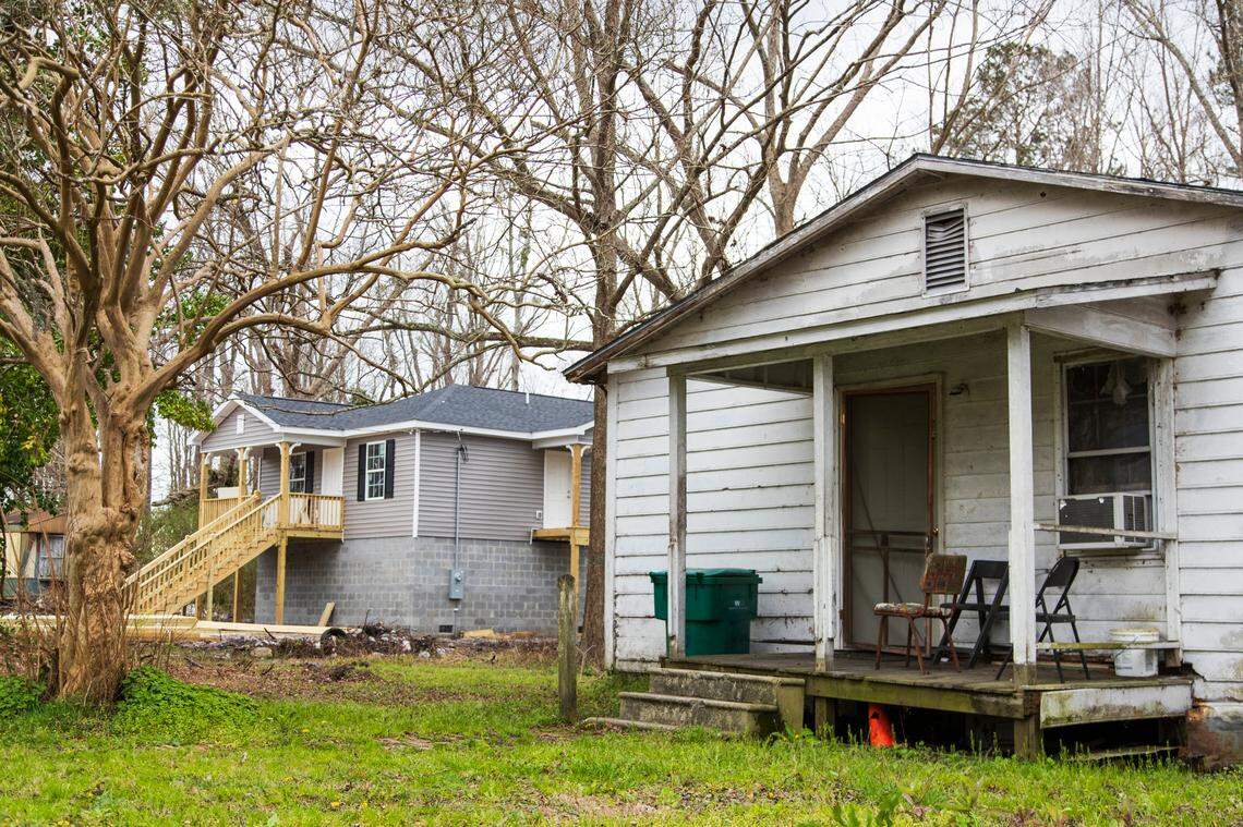 A hurricane and flood damaged home next to a repaired home in Sellers, South Carolina on February 13, 2020. Homeowners with a clear title and insurance have rebuilt their homes in Sellers, many homeowners have not received disaster assistance and live with mold and leaks.