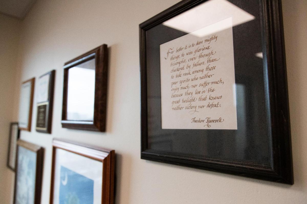 Gary Simrill, R-York, displays his favorite quote from Theodore Roosevelt, calligraphed by his wife, Mary Ruth. Simrill says he works the quote into speeches whenever he can.