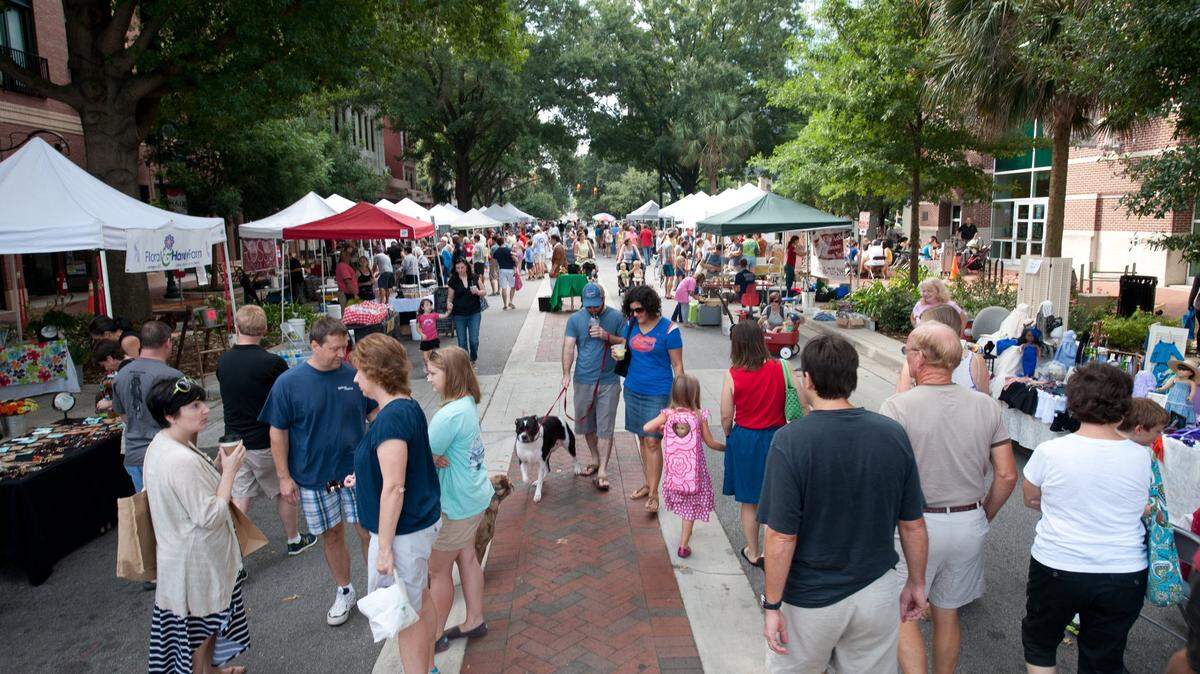 A crowd of people shop at the Soda City Market in downtown Columbia.