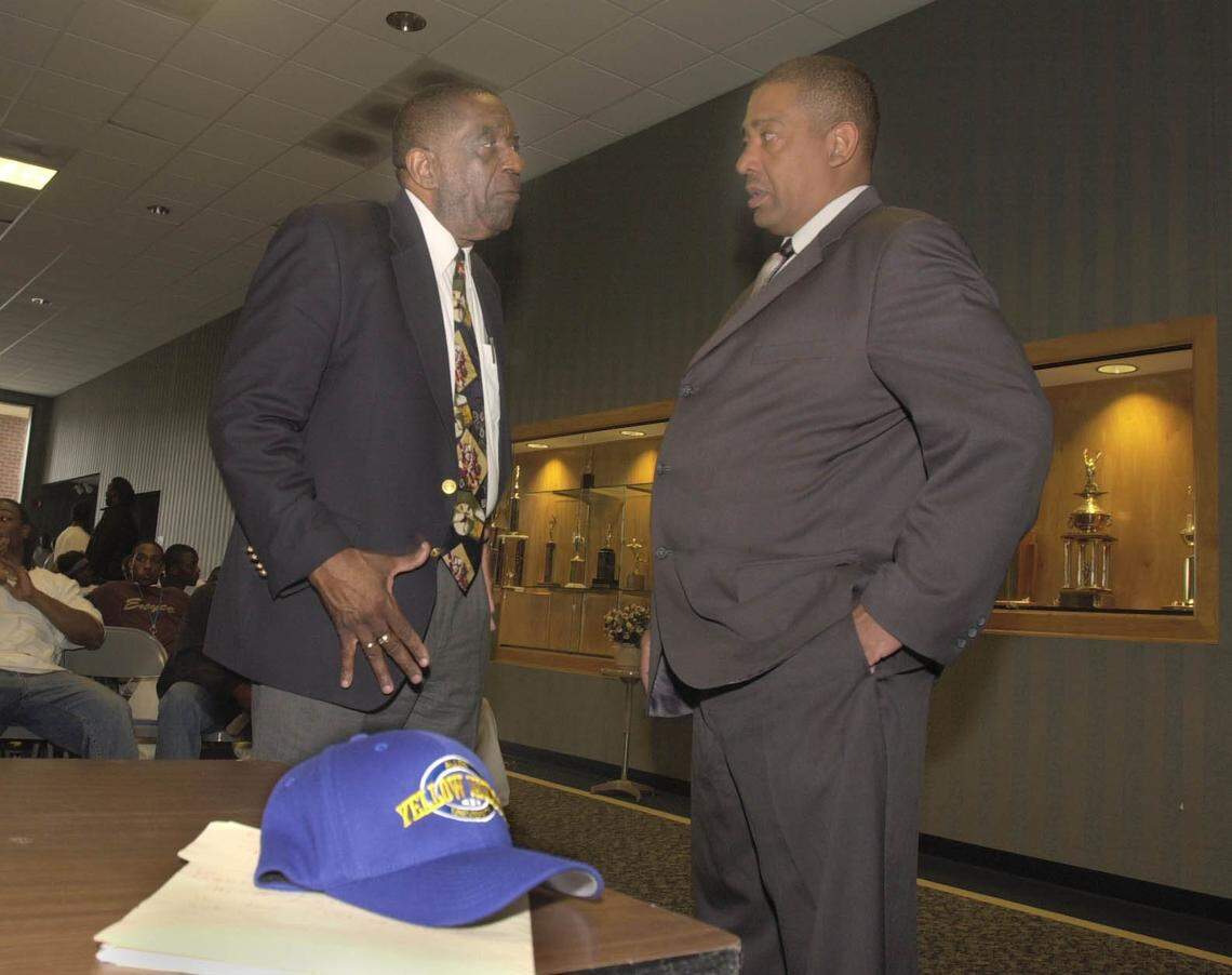 In this 2003 file photo, Allen graduate Clyde Hill (left) chats with Sherman R. Simmons, the university’s newly named head football coach, at an on-campus news conference.