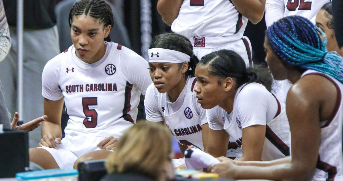 Coach Dawn Staley talks in the huddle during a time out during the second half of action against Florida in the Colonial Life Arena.
