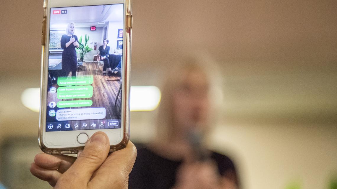 An attendee at a brunch hosted by Dr. Jennifer Clyburn Reed with women community leaders livestreams U.S. Sen. Kirsten Gillibrand Saturday Feb. 9, 2019, in Columbia, SC.