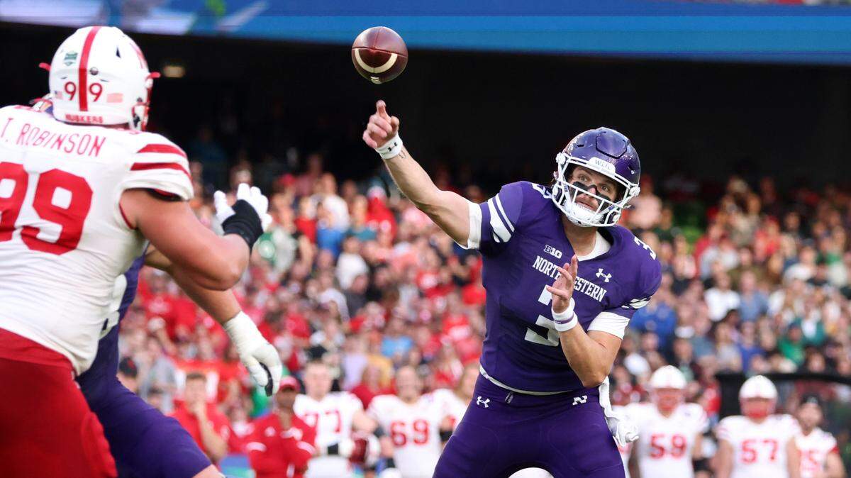 Northwestern quarterback Ryan Hilinski (3) throws a pass over Nebraska defensive lineman Ty Robinson (99) during the first half of an NCAA college football game, Saturday, Aug. 27, 2022, at Aviva Stadium in Dublin, Ireland.