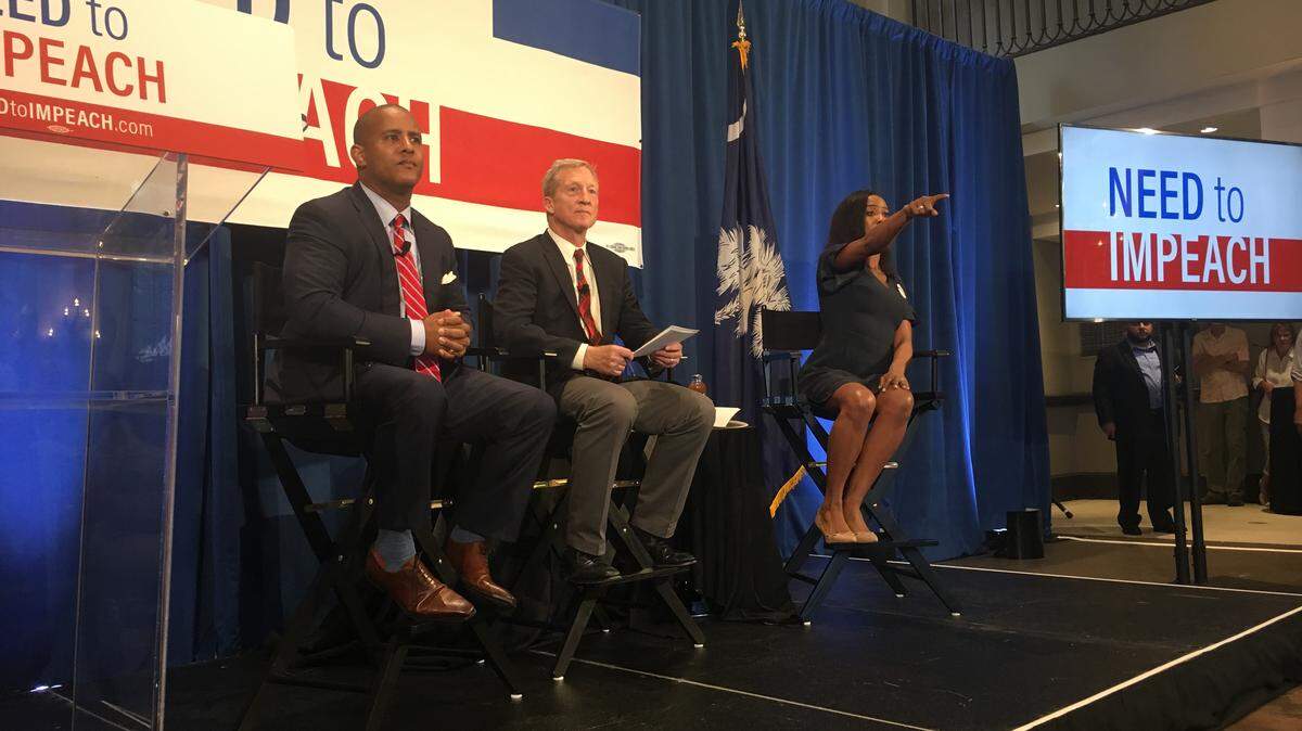S.C. House Minority Leader Todd Rutherford, D-Richland, left, joined California megadonor Tom Steyer, middle, on Wednesday, May 23, 2018, in downtown Columbia. Steyer stopped in Columbia Wednesday as part of his tour to impeach President Donald Trump