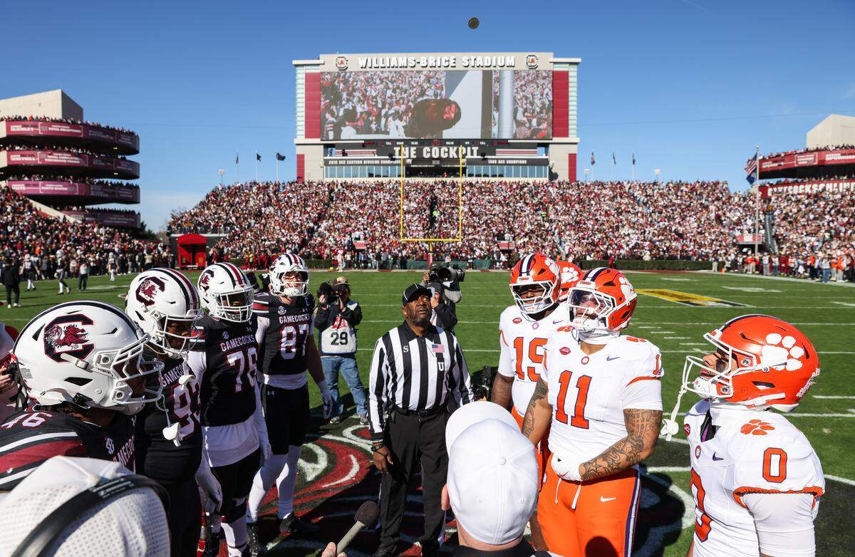 The coin toss is performed at midfield before South Carolina’s game against Clemson at Williams-Brice Stadium in Columbia on Saturday, November 29, 2025.