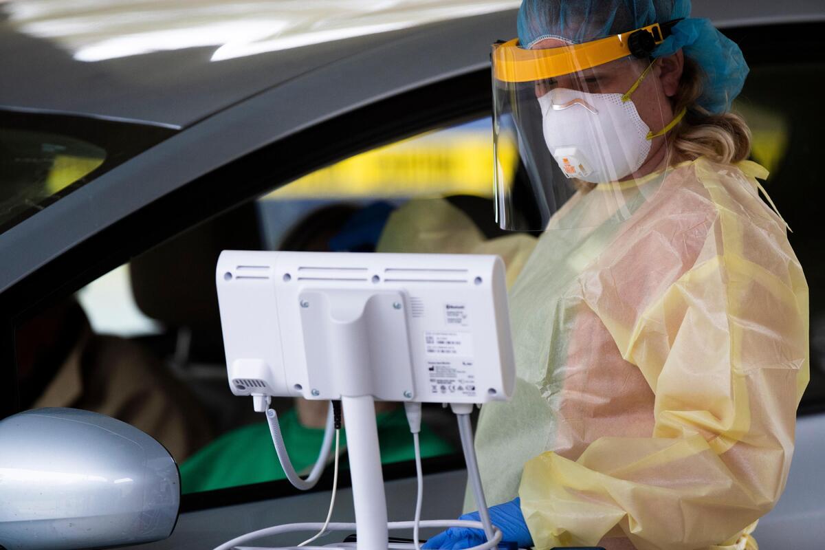 A nurse checks a patients temperature at the Kershaw Mental Health Clinic in Camden, South Carolina on Monday, March 23, 2020.