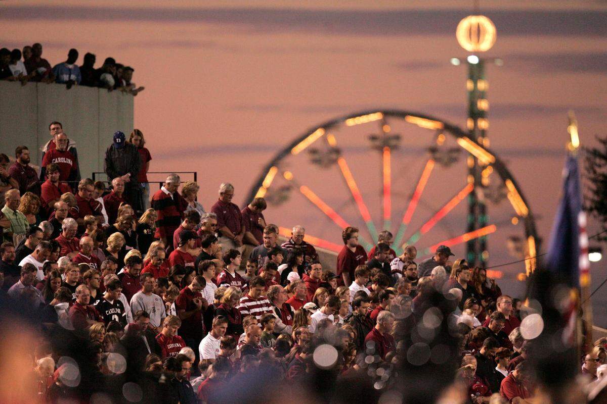 The South Carolina State Fair ferris wheel is seen in the background as fans prepare for the start of a Gamecocks game at Williams-Brice Stadium in Columbia, SC, Saturday, October 24, 2009.
