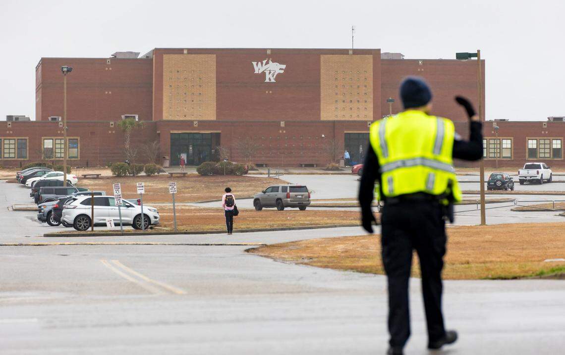 A Lexington County Sheriff’s deputy directs traffic outside White Knoll High School as parents and guardians pick up students Thursday morning after students were sent home due to a threat to the school and several others in the area Feb. 2, 2023.