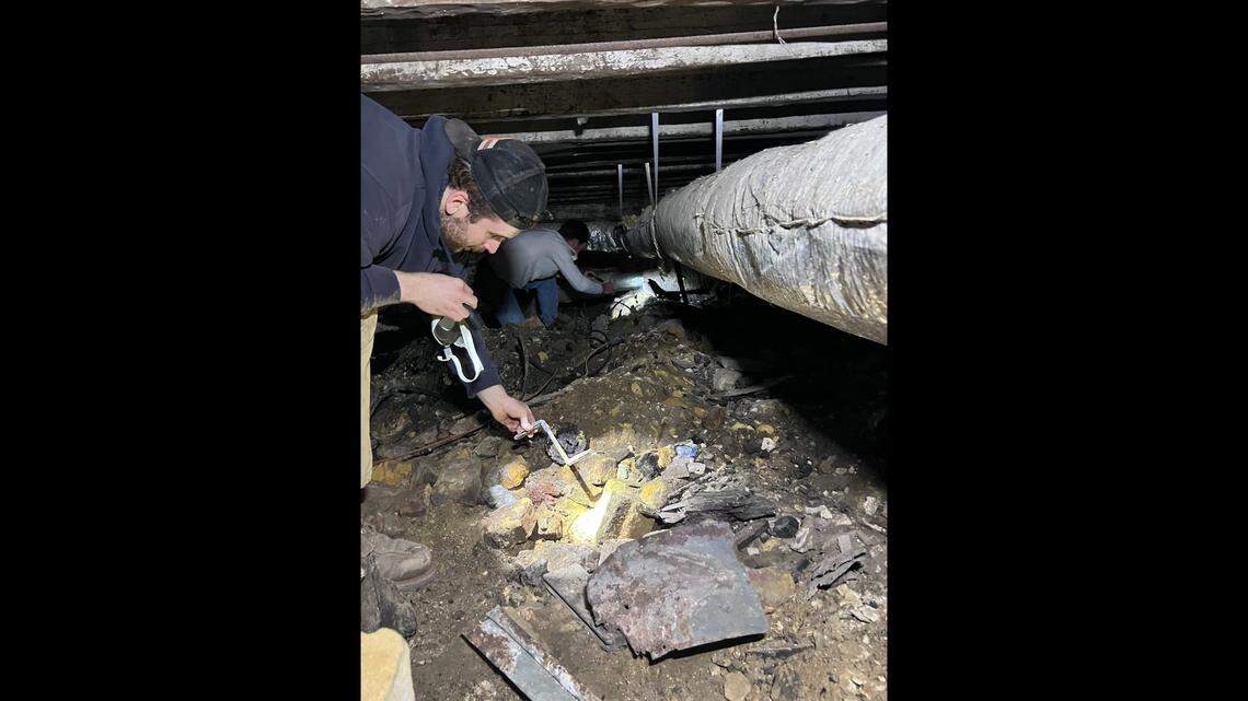 The basement of the Tradd Street home is mysteriously covered with 4-feet of debris, making it a challenge to explore.