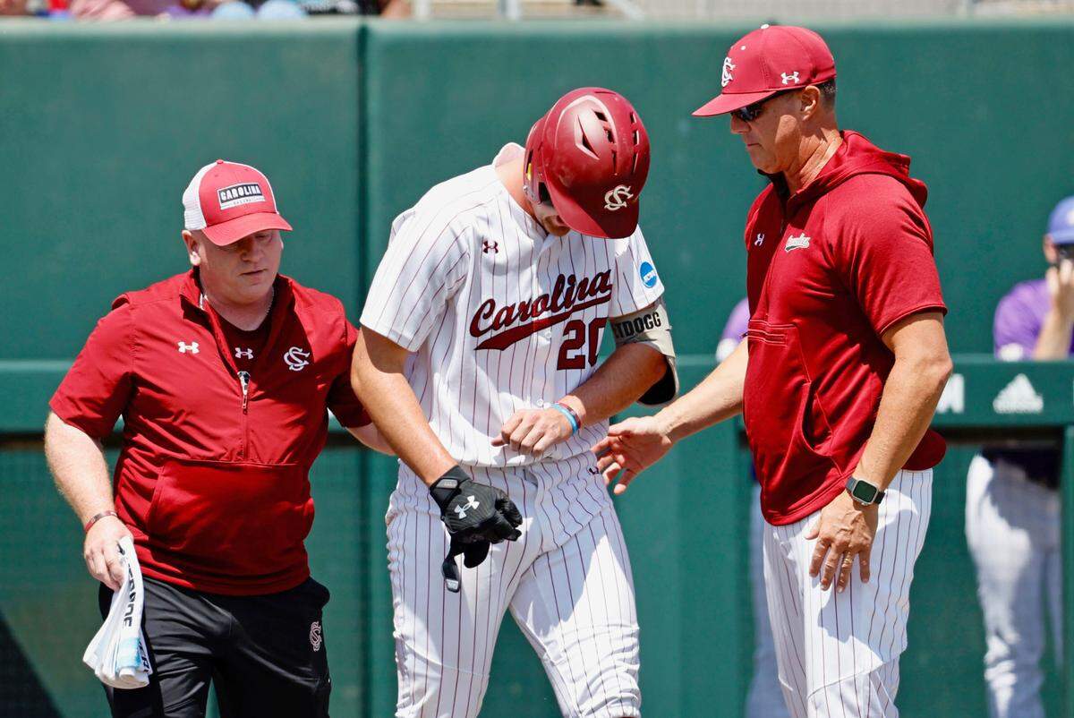 South Carolina’s Ethan Petry, after being hit by a pitch on his left hand, walks slowly to first base Friday in the third inning of their game against James Madison in the NCAA Tournament at Doak Field at Dail Park in Raleigh, N.C.