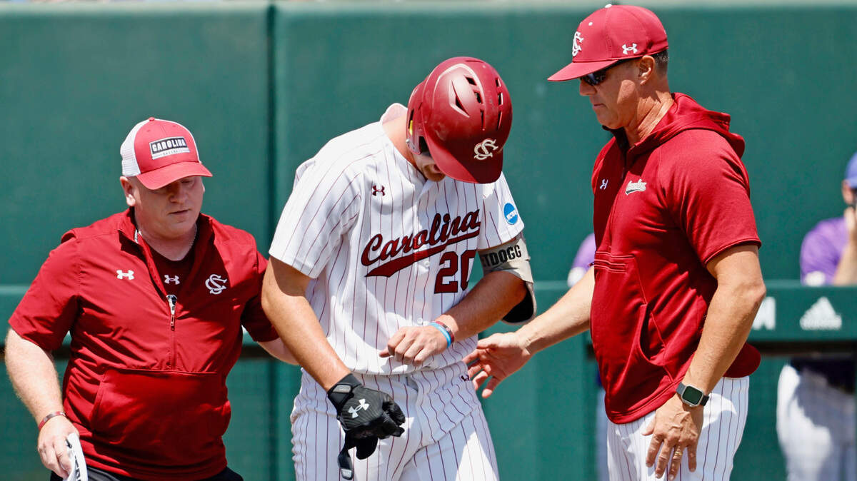 South Carolina’s Ethan Petry, after being hit by a pitch on his left hand, walks slowly to first base Friday in the third inning of their game against James Madison in the NCAA Tournament at Doak Field at Dail Park in Raleigh, N.C.