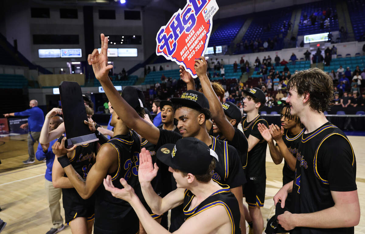 Lexington players celebrate their win over James F. Byrnes in the SCHSL 5A Boys Basketball State Final at the Florence Center on Friday, March 1, 2024.