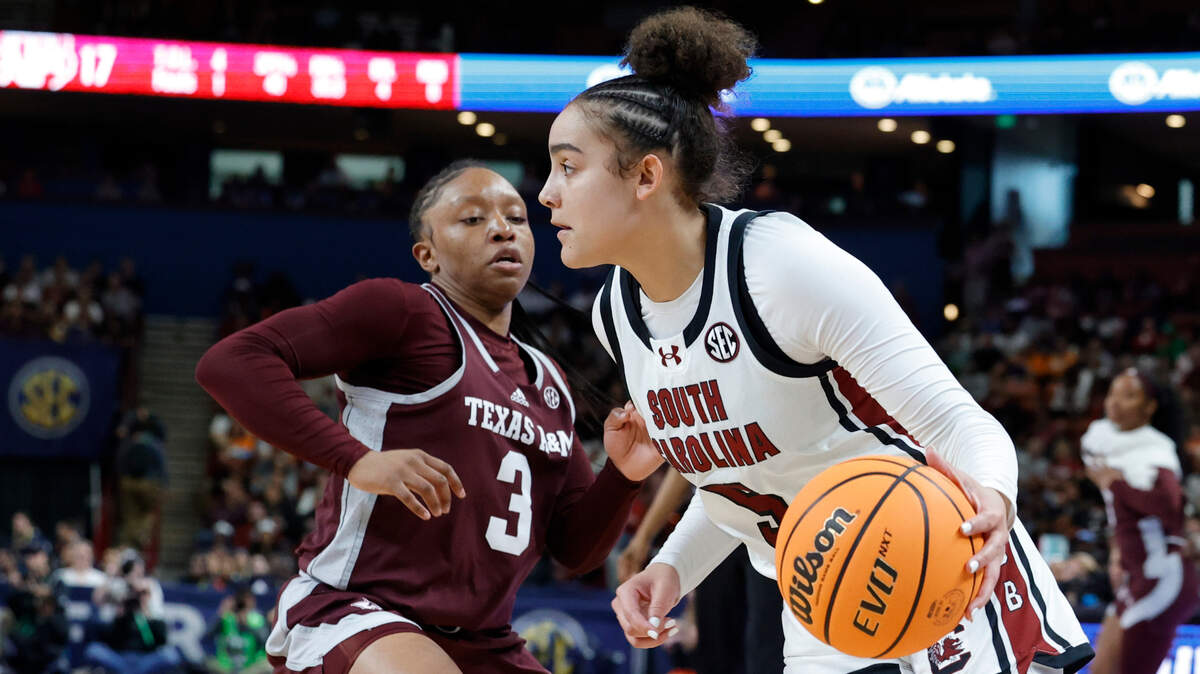 South Carolina’s Tessa Johnson (5) drives around Texas A&M’s Teeny Hilton (3) during the first half of action in the Bon Secours Wellness Arena in Greenville on Friday, Mar. 8, 2024