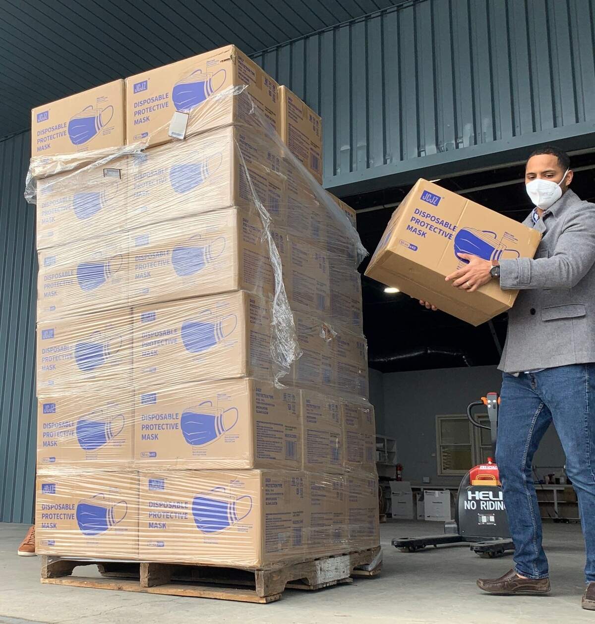 COO of Rhino Medical Supply Elliott Haney moves boxes of medical-grade masks from the company’s warehouse on Rosewood Drive in Columbia, S.C. to be donated.