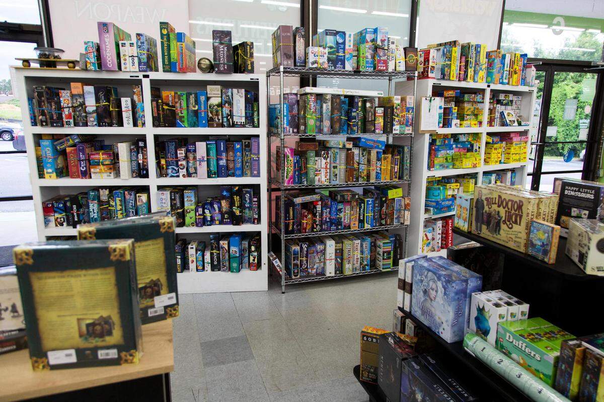 Firefly Toys and Games on Wednesday, July 14, 2021. Firefly has a wall of board games people can try out in the store before purchasing.