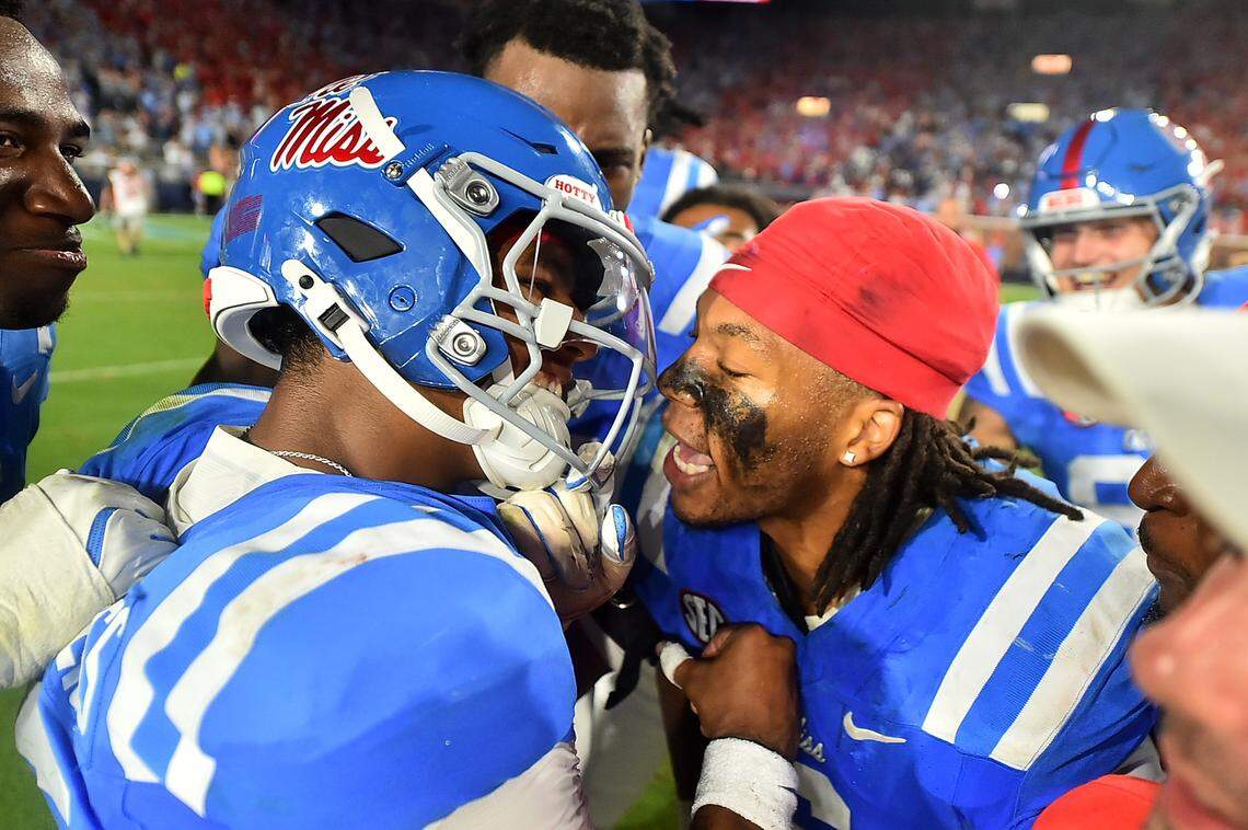 Ole Miss LB TJ Dottery (right, helmet off)