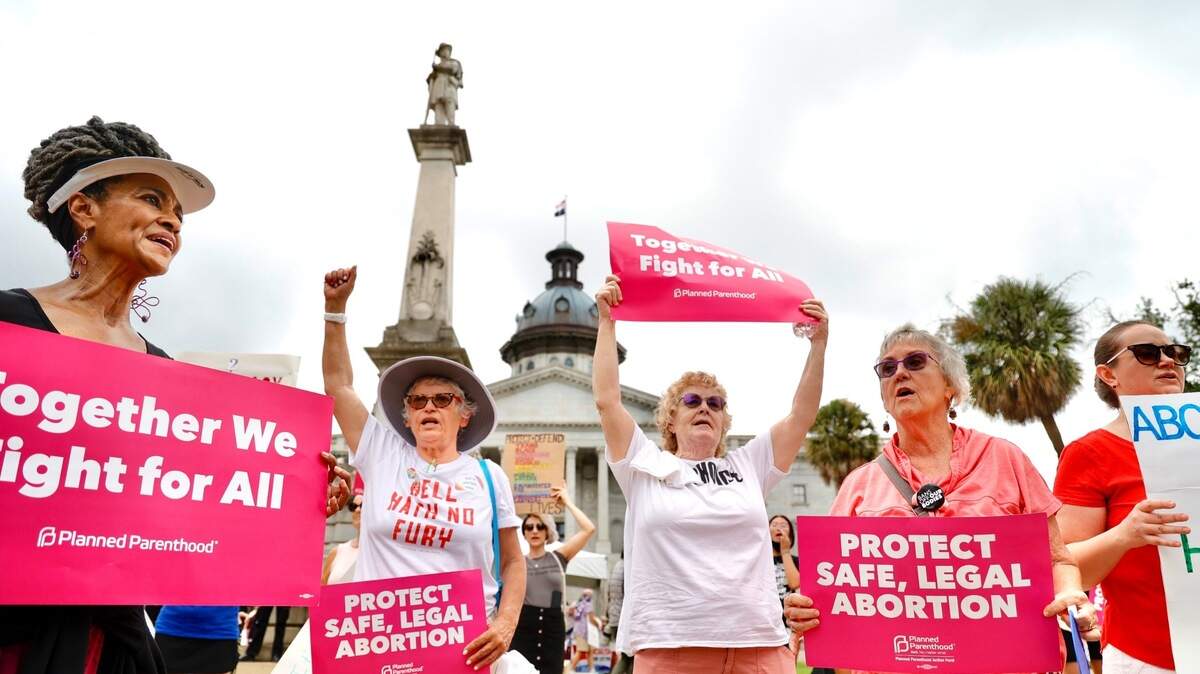 Abortion rights protesters stand outside of the S.C. State House on Tuesday, Aug. 30, 2022, as the S.C. House readies to debate anti-abortion legislation.