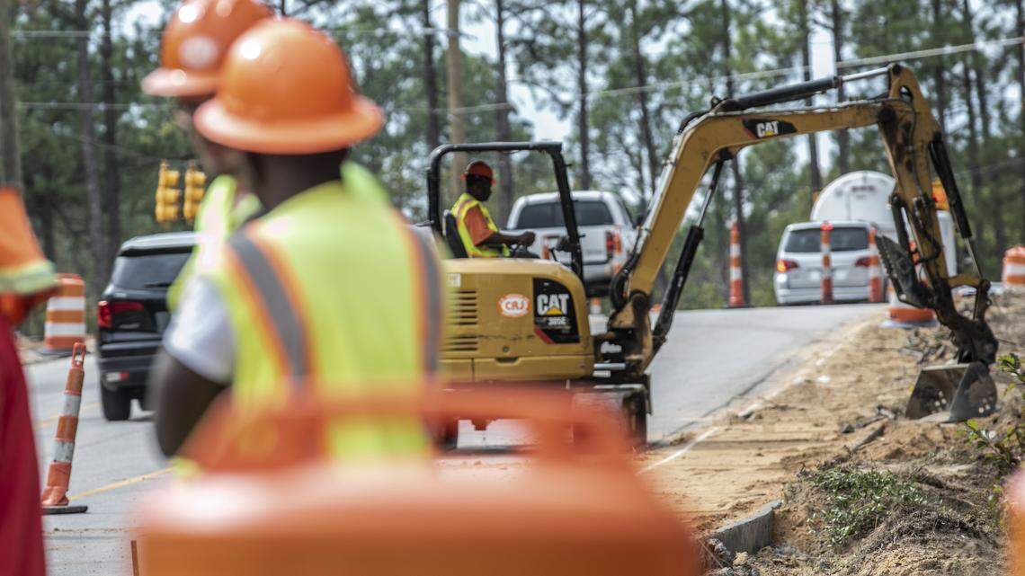 Workers with C.R. Jackson, work on a road widening and sidewalk project on Clemson and Earth roads. The project is one of the Richland County penny tax projects. 10/15/19