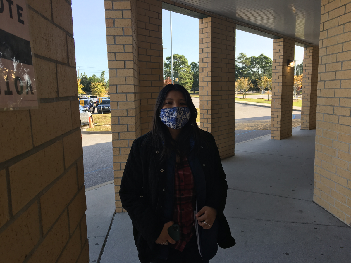 America Tlaczani, 20 standing outside the Spring Valley High School precinct in Columbia, SC. She voted in her first presidential election on Tuesday, Nov. 3.