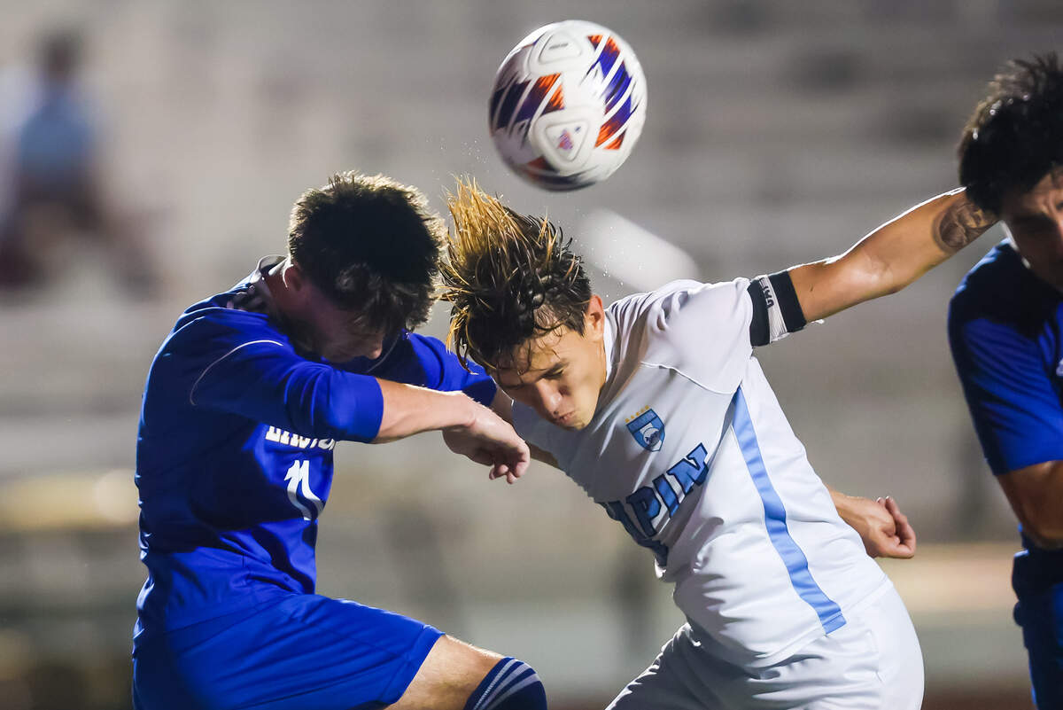 Eastside High Eagles midfielder Hunter Kazian (11) and Chapin High Eagles forward Jacob Braden (8) battle for a header during the Class 5A-Division II state championship game at Memorial Stadium in Columbia, South Carolina, on May 23 of this year.