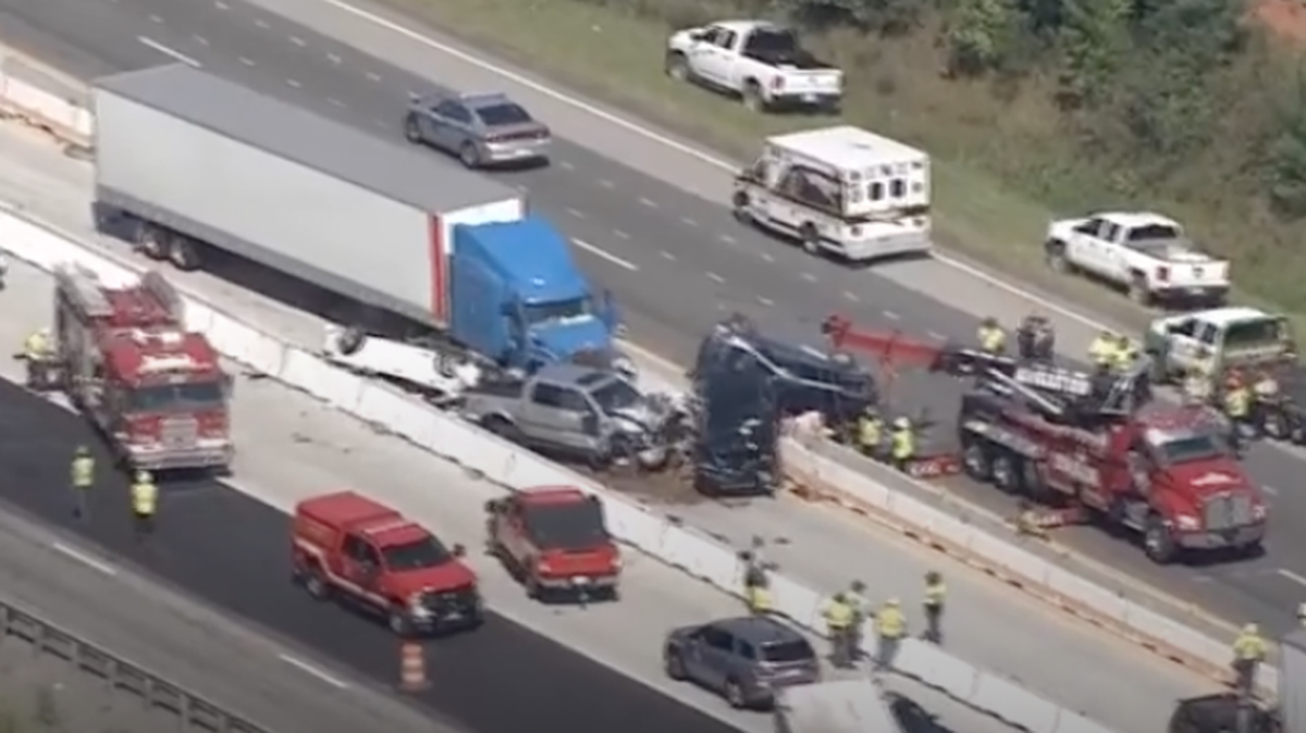 Karen Goggins died after a tractor trailer rammed into the back of her Ford Escape. Her husband was injured.