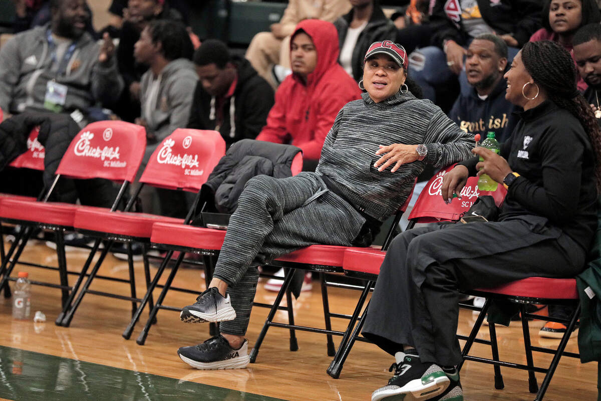 South Carolina basketball coach Dawn Staley looks on Tuesday as the Keenan and Camden high school girls basketball teams face off in their showcase game at the 2022 Chick-fil-A Classic, held at River Bluff High School.