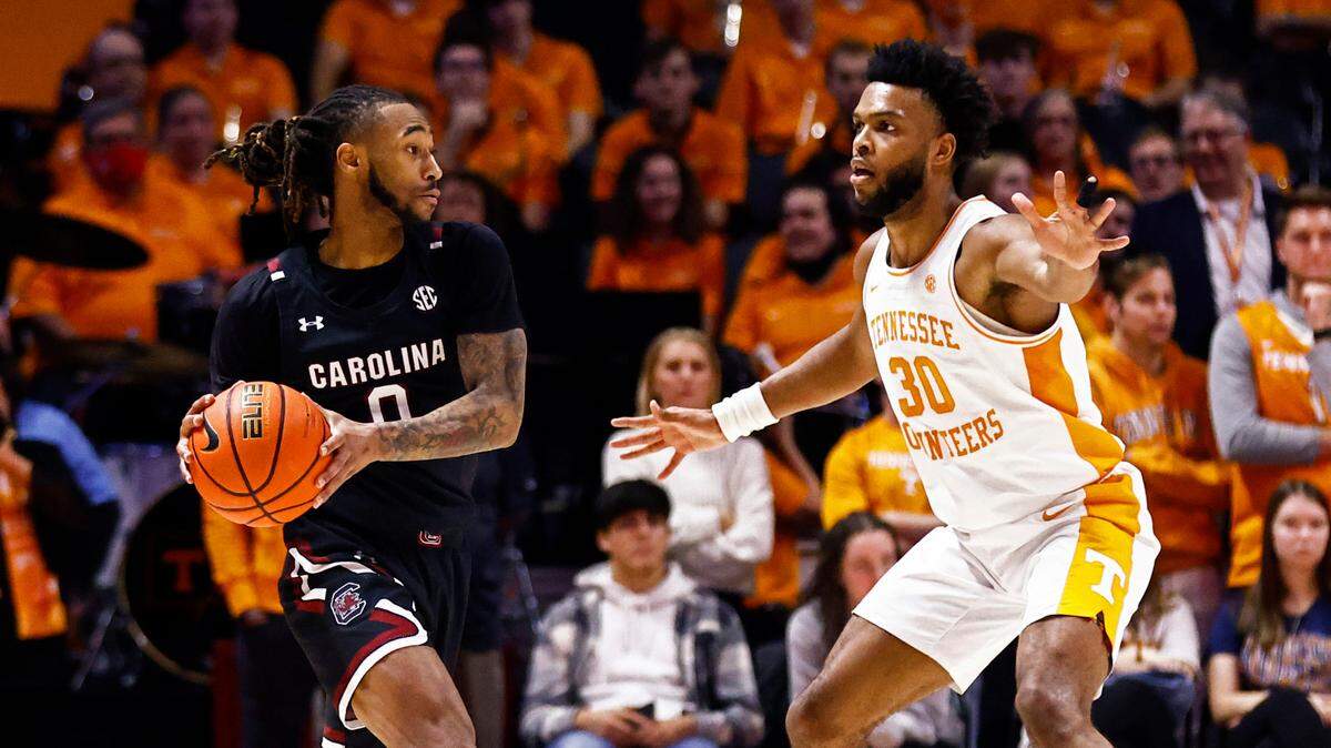 South Carolina guard James Reese V (0) looks to pass as Tennessee guard Josiah-Jordan James (30) defends during an NCAA college basketball game Tuesday, Jan. 11, 2022, in Knoxville, TN. (AP Photo/Wade Payne)