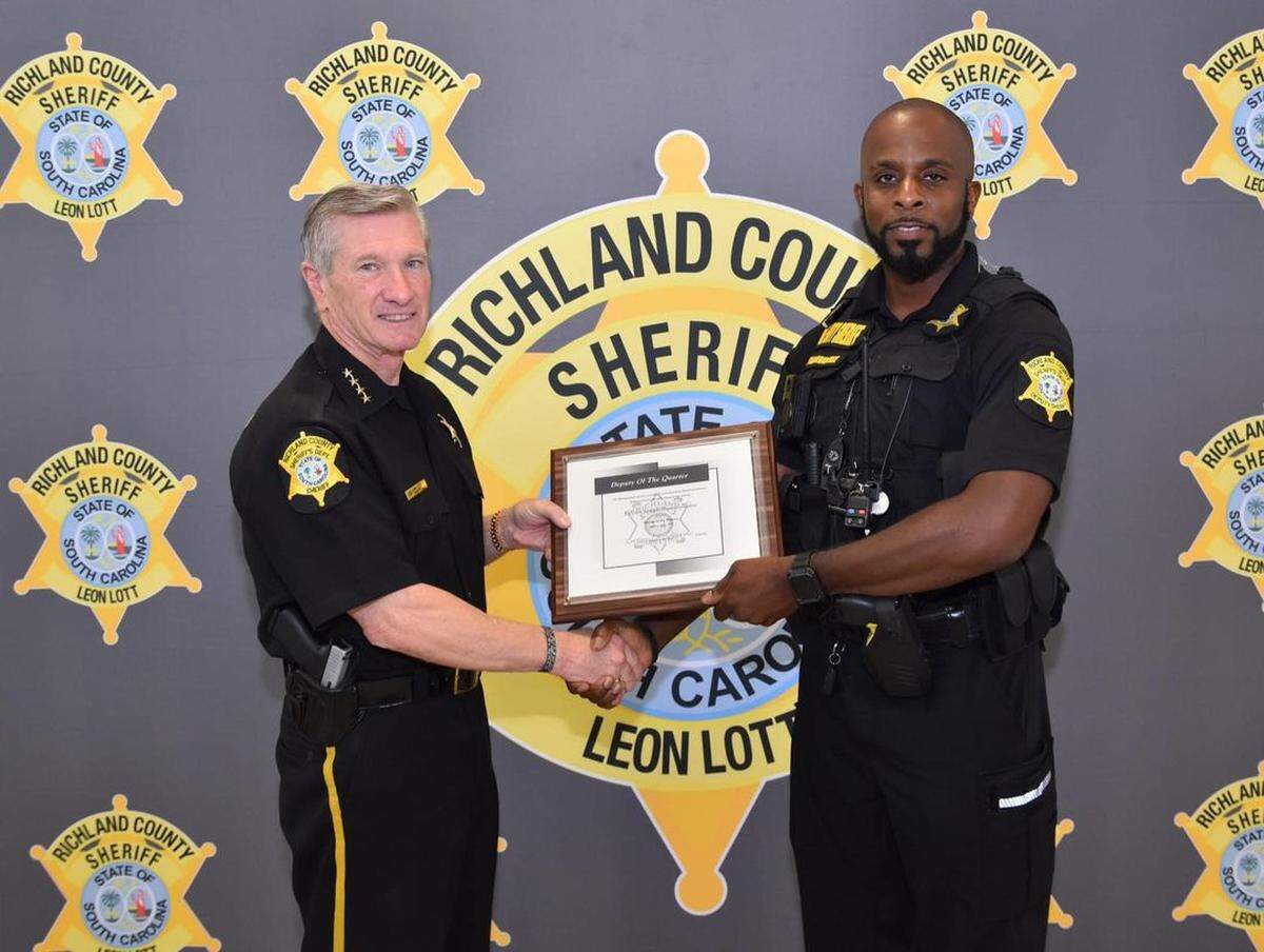 This file photo shows Richland County Sheriff Leon Lott, left, and Deputy Joseph Shannonhouse. The deputy was injured in an early-morning shooting.