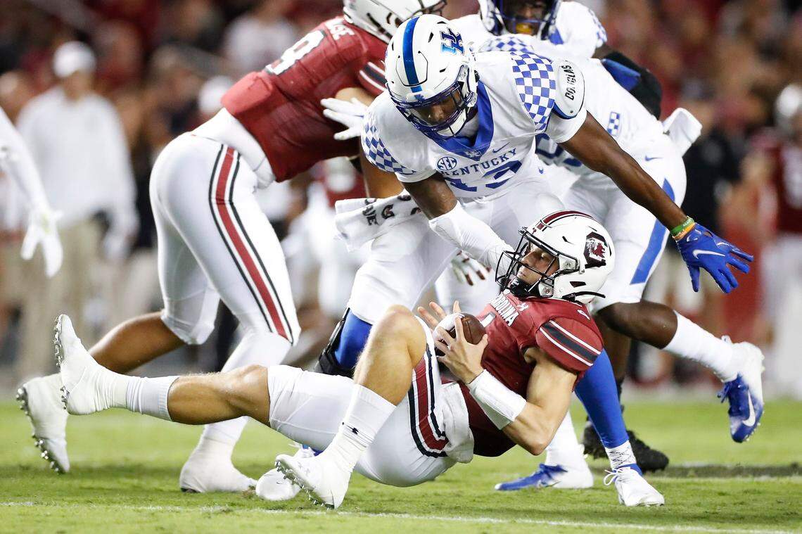 Kentucky Wildcats linebacker J.J. Weaver (13) sacks South Carolina Gamecocks quarterback Luke Doty (4) during a game at Williams-Brice Stadium in Columbia, S.C., Saturday, Sept. 25, 2021.