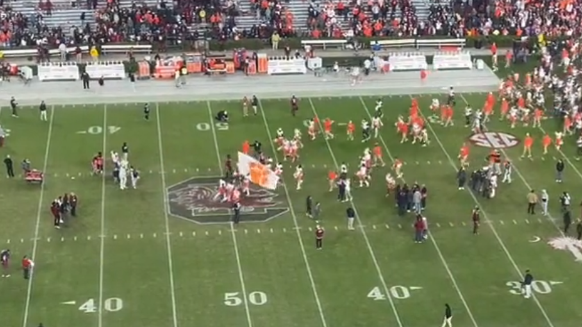 Clemson football players, led by linebacker Jeremiah Trotter Jr., approach the 50-yard line at Williams-Brice Stadium after beating Clemson 16-7 on Saturday, Nov. 25, 2023.