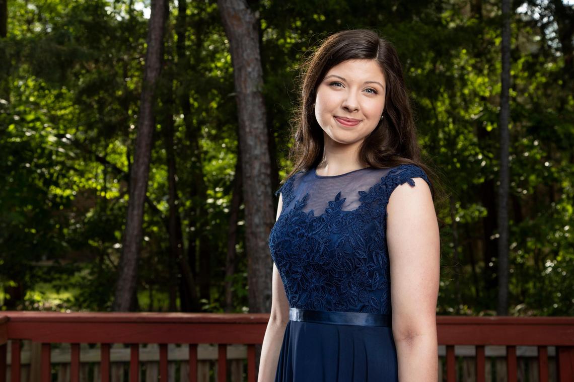 Allison Branham, a student at Dutch Fork High School, poses for a portrait in her prom dress in her backyard on April 20, 2020. Branham imagined going to prom as a child and is disappointed to not be able to attend her senior prom.