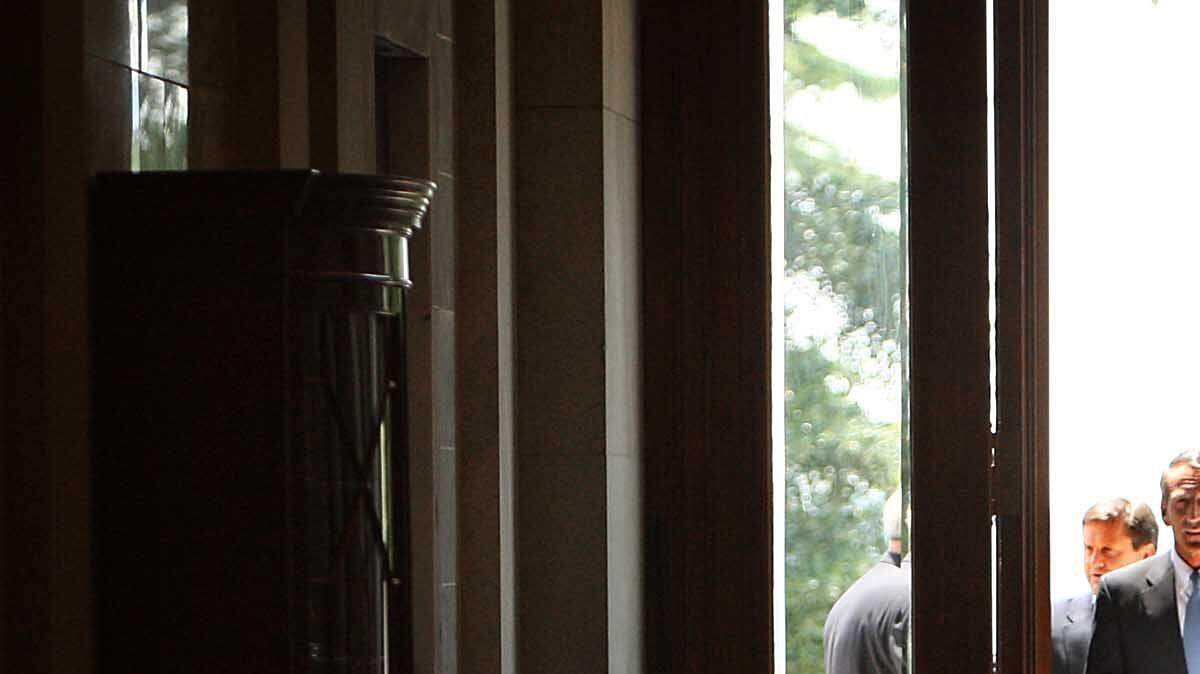 South Carolina Gov. Mark Sanford enters the State House to explain his six-day absence and extra-marital affair to members of the news media.