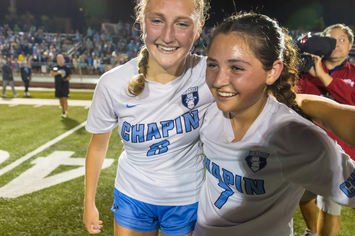 Chapin High’s Sydney Stoner (6) and Avery Stoner (7) celebrate following their 4-0 win May 23 in the Class 5A-Division II state championship game at Memorial Stadium in Columbia.