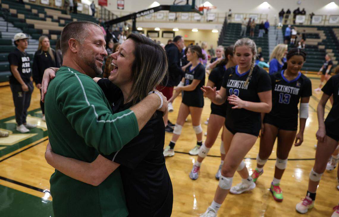 Lexington head coach Erica Hardin celebrates with her husband, River Bluff football coach Blair Hardin, following her team’s volleyball match at River Bluff on Thursday, October 17, 2024.