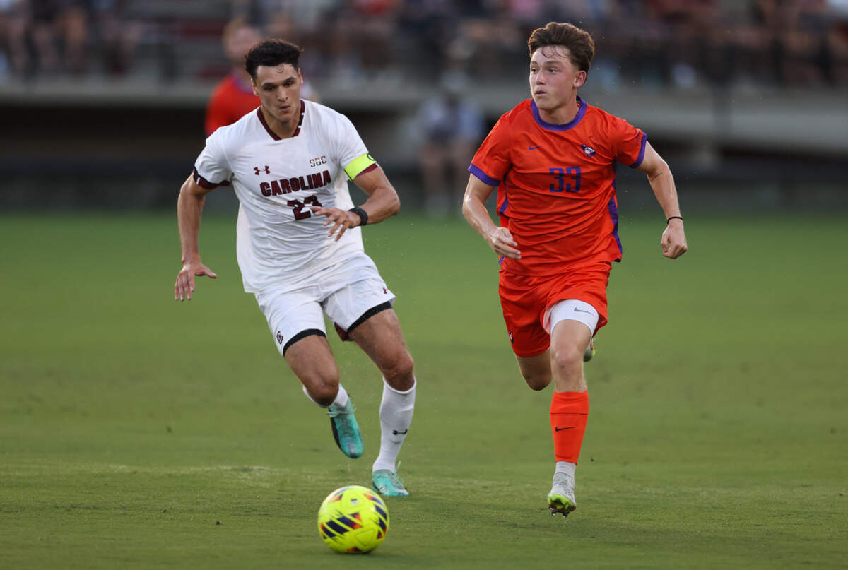 South Carolina forward Harrison Myring (23) chases down Clemson defender Arthur Duquenne (33) during the Gamecocks’ game against Tigers in Columbia on Friday, August 30, 2024.