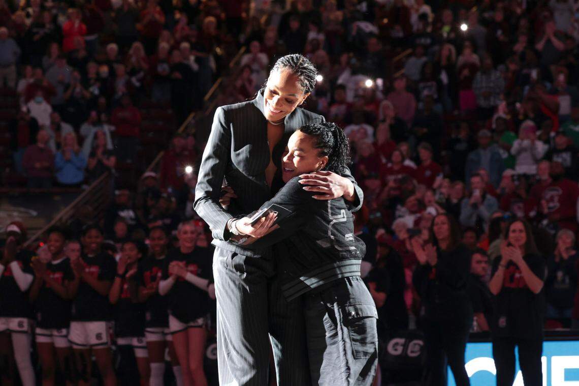 A’ja Wilson embraces her former coach, Dawn Staley, during a ceremony to retire her jersey and hang it in the Colonial Life Arena on Sunday, Feb. 2, 2025.