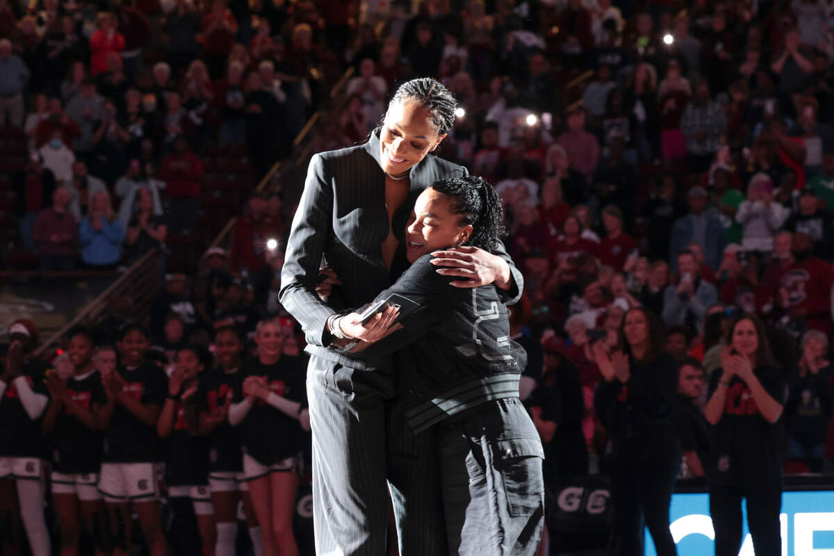 A’ja Wilson embraces her former coach, Dawn Staley, during a ceremony to retire her jersey and hang it in the Colonial Life Arena on Sunday, Feb. 2, 2025.