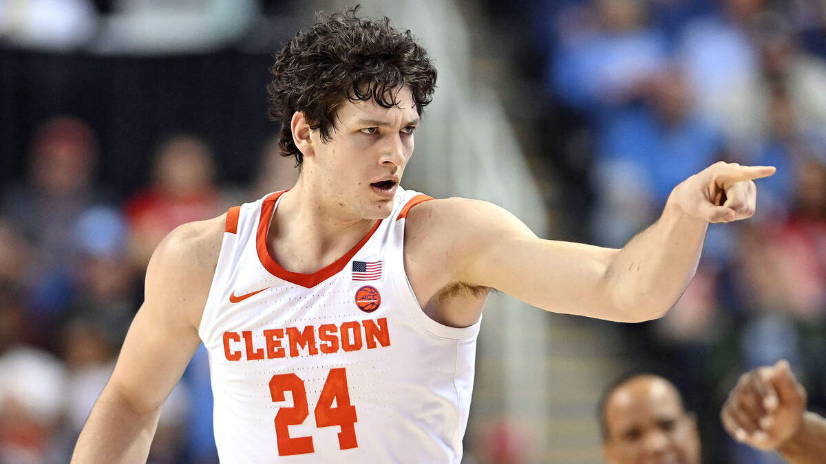 Clemson center PJ Hall (24) reacts after hitting a 3-point shot Thursday against NC State in the ACC tournament at the Greensboro Coliseum.