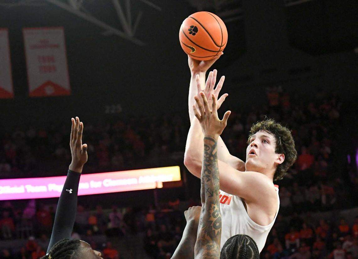 Dec 6, 2023; Clemson, South Carolina, USA; Clemson junior forward PJ Hall (24) makes a shot near University of South Carolina junior guard B.J. Mack (2) during the second half at Littlejohn Coliseum. Mandatory Credit: Ken Ruinard-USA TODAY Sports