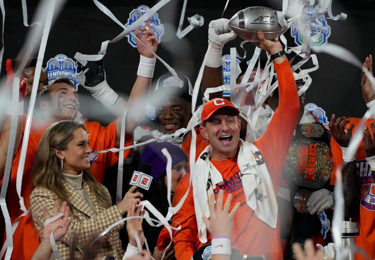 Dec 3, 2022; Charlotte, North Carolina, USA; Clemson Tigers head coach Dabo Swinney celebrates with his team after defeating the North Carolina Tar Heels 39-10 to win the ACC Championship game at Bank of America Stadium. Mandatory Credit: Bob Donnan-USA TODAY Sports