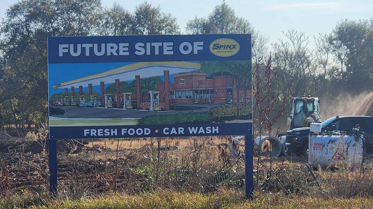 A sign near the corner of US-378 and Charter Oak Road in Lexington touts a coming Spinx store. Land is now being cleared at the site.