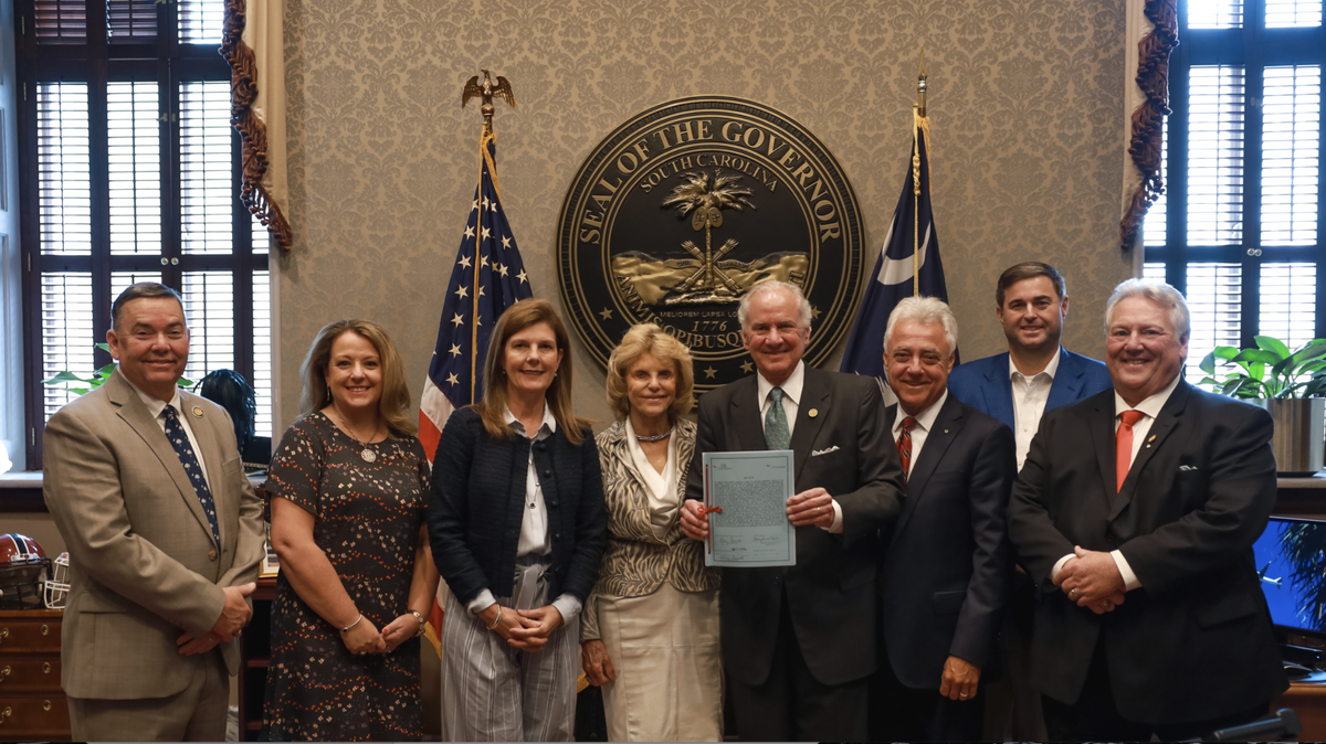 S.C. Gov Henry McMaster, center, signed S. 474, a six-week abortion ban, into law. He was joined by, from left, state Rep. John McCravy, R-Greenwood; state Rep. Melissa Oremus, R-Aiken; S.C. Lieutenant Gov. Pamela Evette; first lady Peggy McMaster; state Sen. Larry Grooms, R-Berkeley; House Speaker Murrell Smith, R-Sumter; and state Sen. Billy Garrett, R-McCormick.