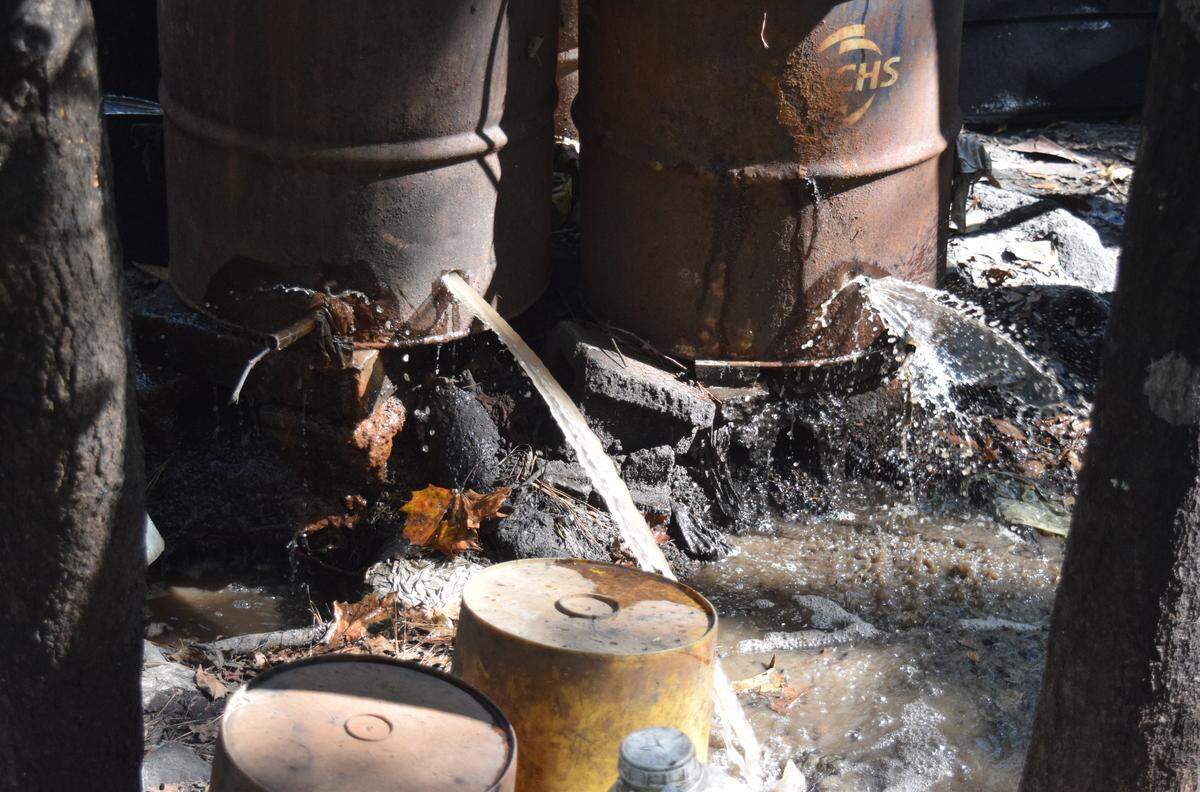 The liquor was still fermenting in the barrells, the sheriff said.