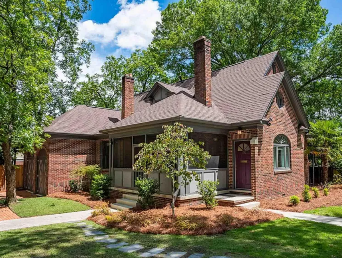 A 4-bedroom home at 100 Sunrise Ave., in Shandon with a walk-in closet and farmhouse kitchen fixtures is listed for sale on Zillow July 15, 2026.
