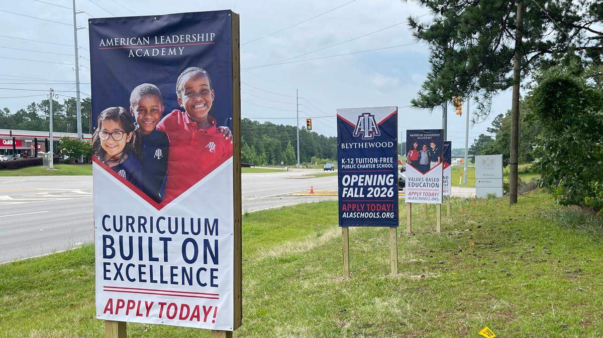 Signs for American Leadership Academy Blythewood posted outside the entrance of the former Policy Management Systems Corp. campus in Blythewood.