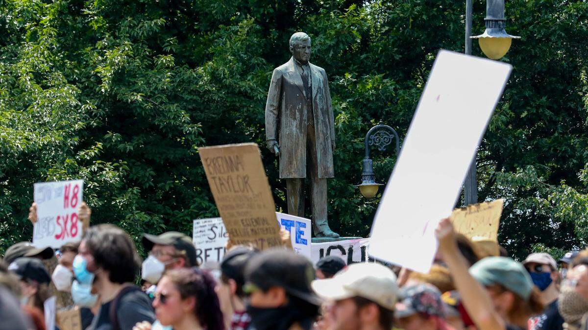 The statue of Ben Tillman is seen through protesters at the S.C. State House. Protesters gathered at the S.C. Governor’s Mansion and marched to the state house to demonstrate their anger over racial injustice.