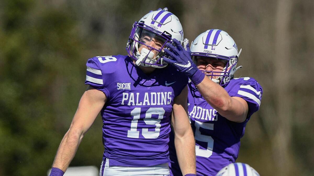 Furman wide receiver Zach Peterson (19) celebrates with teammate wide receiver Noah Henderson (25) after catching a touchdown against Western Carolina in the first half at FurmanÕs Paladin Stadium Saturday, February 20, 2021. Bart Boatwright/Special to The State